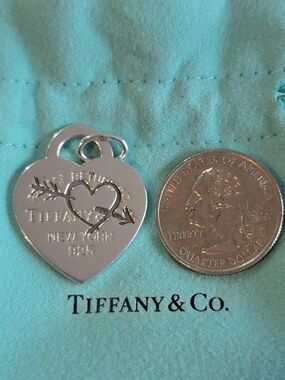 Tiffany & Co. Etched Heart And Arrow Charm Pendant.